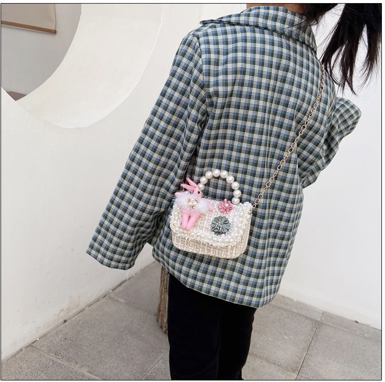 Cute girls' princess purse with crown design, pearl handle, bunny motif, and cartoon style for toddlers and young girls.