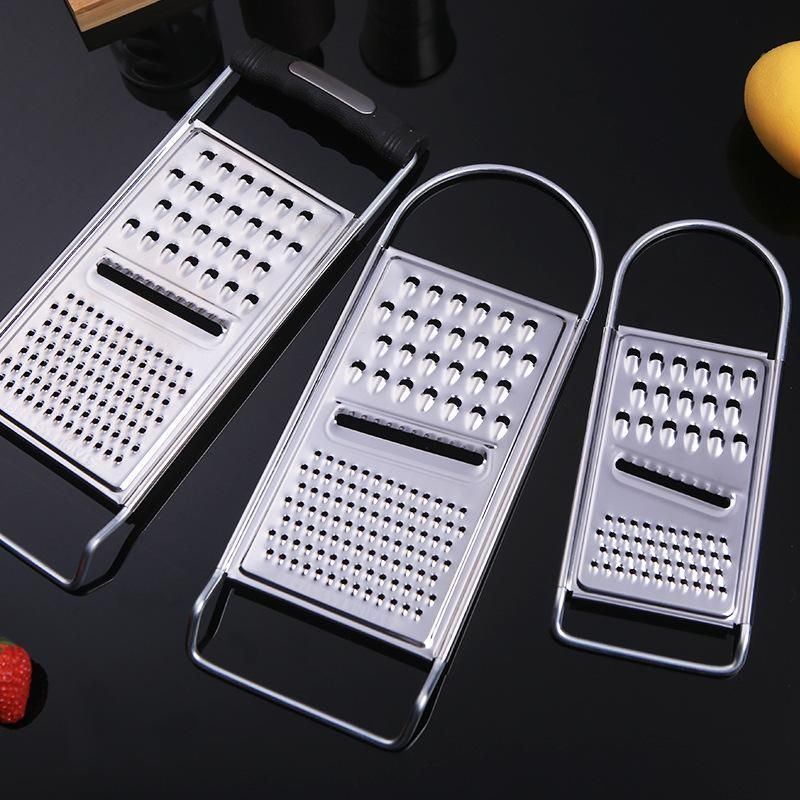 Two ergonomic metal food graters for cheese, garlic, lemon, and ginger, ideal for baby and kids feeding, by Everything Baby.