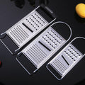 Two ergonomic metal food graters for cheese, garlic, lemon, and ginger, ideal for baby and kids feeding prep.
