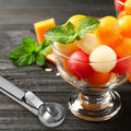 Two stainless steel ice cream scoops with trigger mechanism, suitable for fruit and ice cream, by Everything Baby.