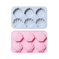 Silicone shell-shaped ice cube tray with easy-release design, ideal for chocolates, soap, or wax melts, by Everything Baby.