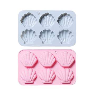 Silicone shell-shaped ice cube tray with easy-release design, ideal for chocolates, soap, or wax melts, by Everything Baby.