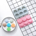 Two silicone shell-shaped ice cube trays with easy-release, non-stick surface, ideal for chocolates, soaps, and crafts.