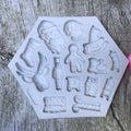 Two Christmas-themed Santa and elk gift socks silicone molds for cake, cookies, and dessert decoration, ideal for holiday baking.