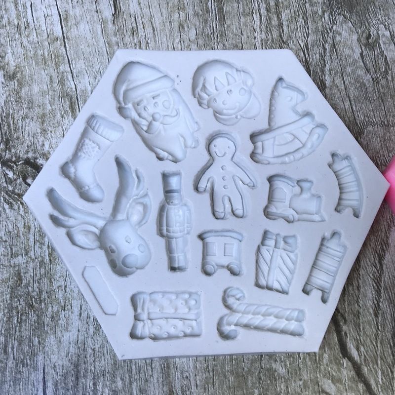 Two Christmas-themed Santa and elk gift socks silicone molds for cake, cookies, and dessert decoration, ideal for holiday baking.
