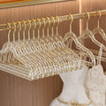 Set of 10 clear plastic hangers with gold glitter non-slip coating, ideal for baby boys' sleepwear and clothing organization.