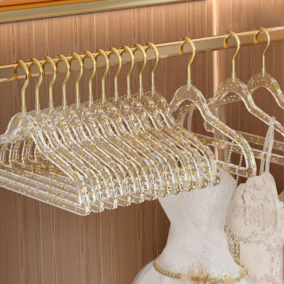 Set of 10 clear plastic hangers with gold glitter non-slip coating, ideal for baby boys' sleepwear and clothing organization.