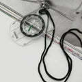 Waterproof outdoor compass by Everything Baby, designed for kids and scouts, featuring a clear compass face and sturdy strap.