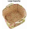 Cotton quilted floral foldable storage basket with handles for baby and kids toy organization and home laundry storage.
