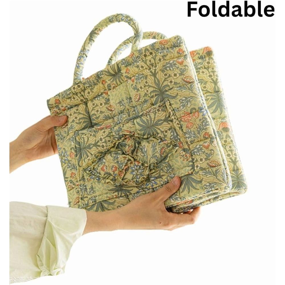 Cotton quilted floral foldable storage basket with handles, ideal for baby toy and laundry organization in a portable home or car.