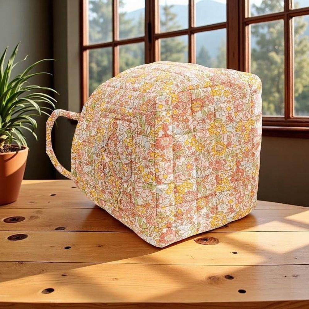Cotton quilted floral foldable storage basket with handles, portable toy and laundry organizer for kids' room.