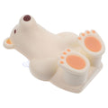 Beige silicone suction cup toothbrush holder for babies and kids, designed for bathroom use, by Everything Baby.
