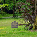 Black metal no trespassing sign with stake for outdoor yard and garden security, suitable for safety and boundary marking