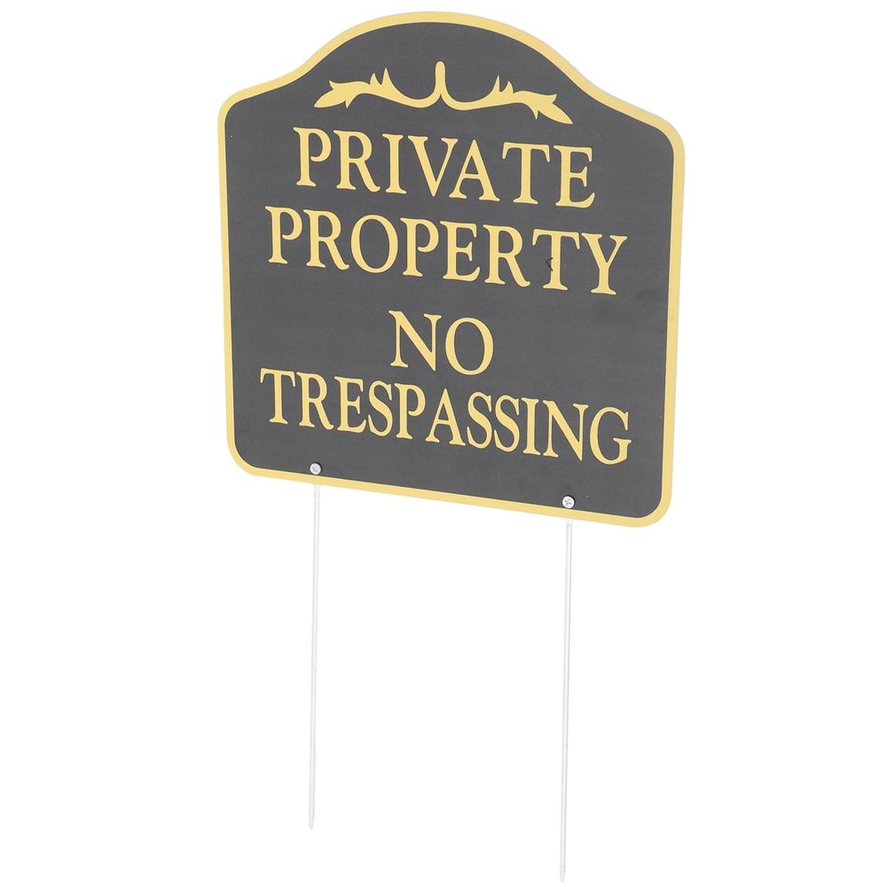 Black metal no trespassing sign on stake for yard and garden security, suitable for outdoor use.