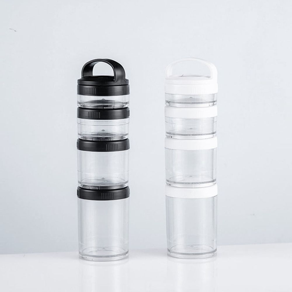 Stackable transparent black snack containers for kids and adults, featuring four cups for school and travel use.