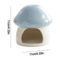 Mushroom-shaped ceramic hamster hideaway house with cozy interior, decorative small animal cage accessory in natural colors.