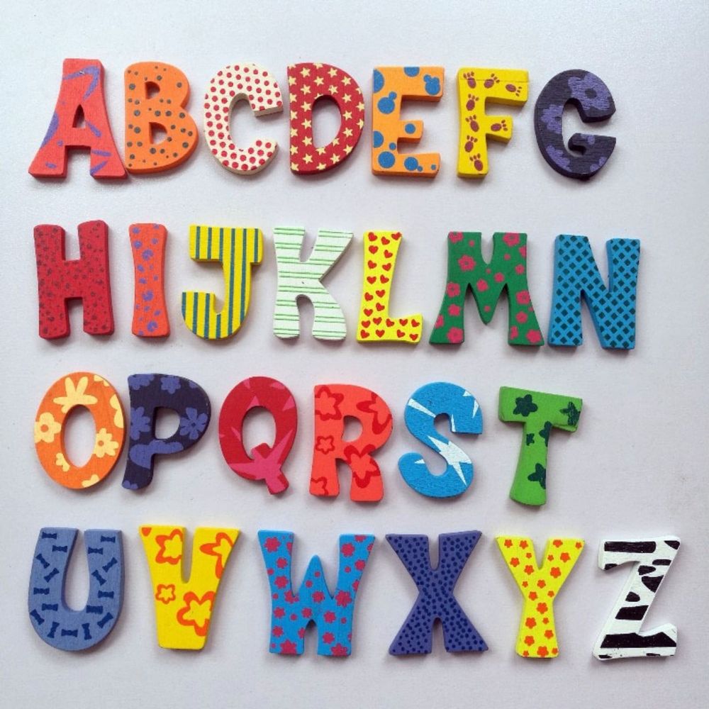 Set of 26 wooden magnetic alphabet letters for fridge, educational toy for kids learning and decorating with soft magnets.