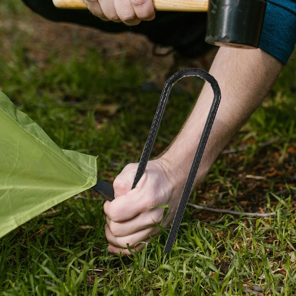 Set of four black heavy-duty steel stakes for garden or outdoor play equipment, easy to install and high strength by Everything Baby.