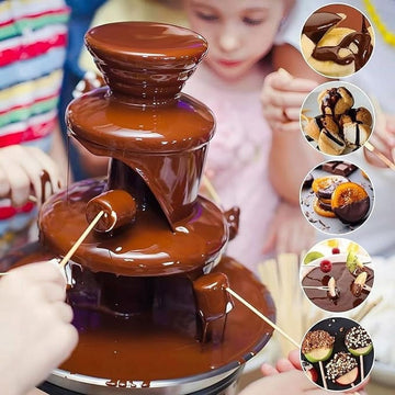 Stainless steel 3-tier chocolate fondue fountain with 10oz mini melting pot for fruit, cheese, and snacks, ideal for parties and gatherings.