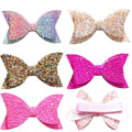 Five colorful glitter hair bows for girls, boutique style clips with sequins, suitable for babies, toddlers, and teens.