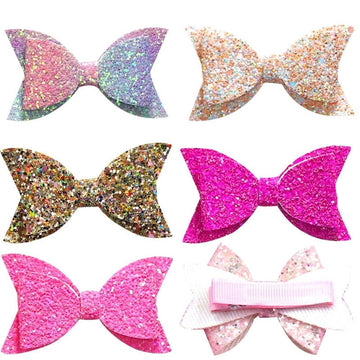 Five colorful glitter hair bows for girls, boutique style clips with sequins, suitable for babies, toddlers, and teens.