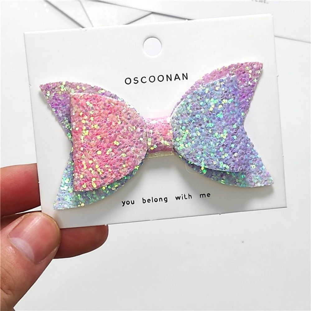 Set of five colorful glitter hair bows for baby girls and toddlers, featuring sequins and large bows by Everything Baby.