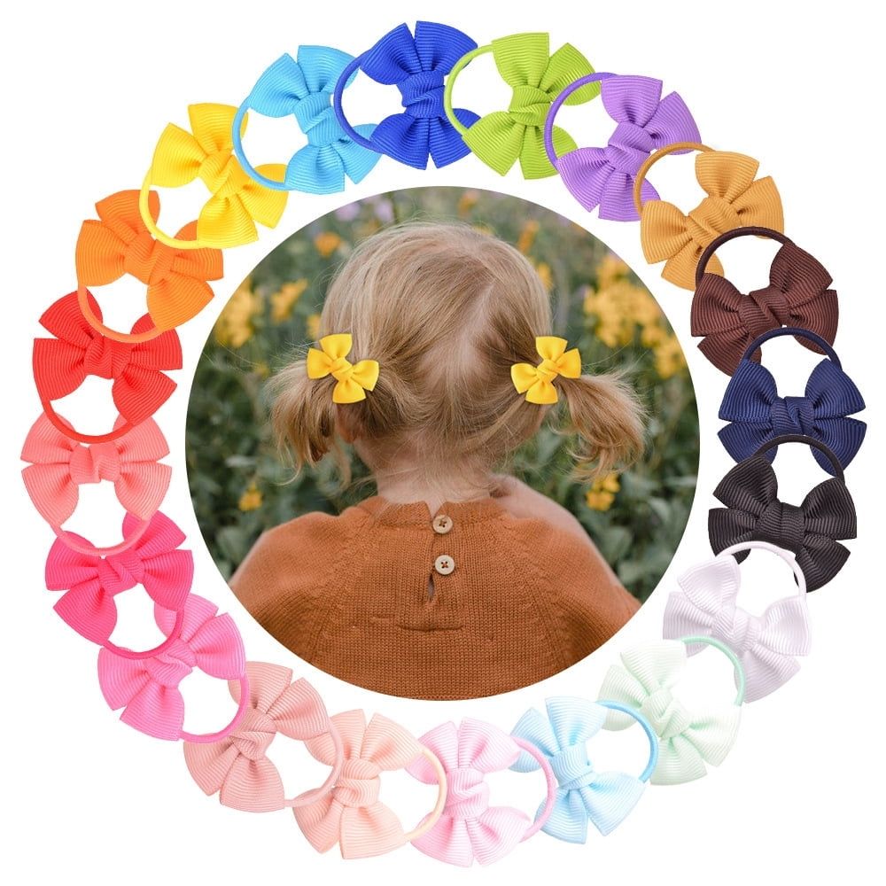 Pair of small elastic baby hair ties with bows, 20-pack for girls' ponytails, toddler hair accessories, from Everything Baby.