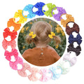 Pair of small elastic baby hair ties with bows, 20-pack for girls' ponytails, toddler hair accessories, from Everything Baby.