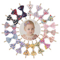 Set of 19 floral baby girl hair bow headbands with stretchy elastic for newborns, infants, and toddlers by Everything Baby.