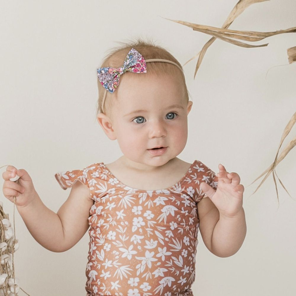 Set of 19 floral baby girl hair bow headbands with stretchy elastic bands for newborns, infants, and toddlers, by Everything Baby.