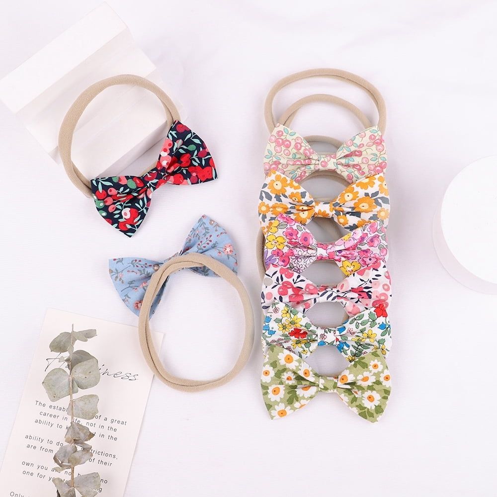 Set of 19 floral baby girl hair bow headbands with stretchy elastic bands for newborns, infants, and toddlers by Everything Baby.