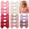 Set of 20 baby hair clips with pink and purple bows, 2-inch alligator clips for toddler pigtails and fine hair styling.