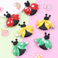 Set of 8 baby hair bows with cute bee and ladybug designs, toddler girl hair accessories from Everything Baby, colorful ribbon clips
