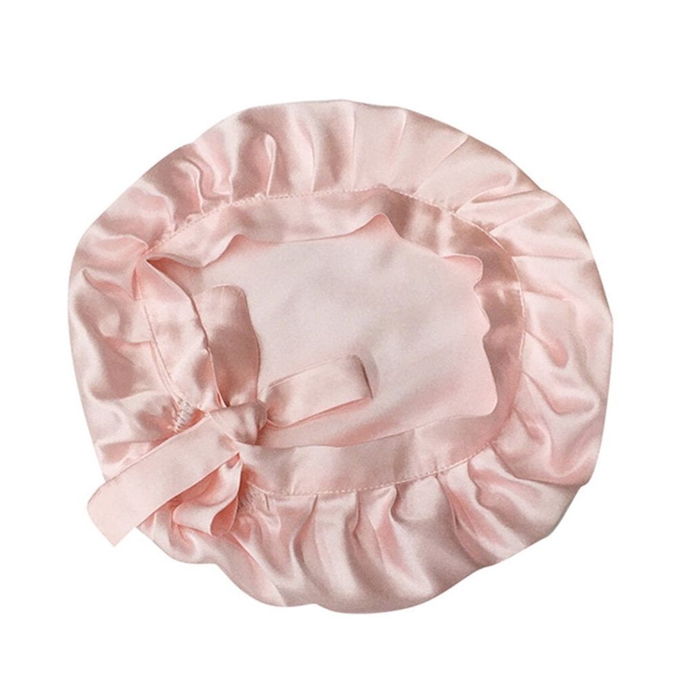 Pure silk girl's sleep cap with adjustable elastic band, soft and comfortable for gentle bedtime hair wrapping.