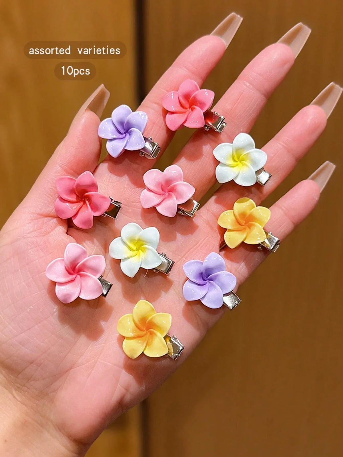 Set of 10 colorful flower hair clips for girls, cute accessory for daily wear, suitable for vacation outfits and hair styling.