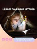 Mini LED flashlights keychain pendants in four colors, perfect for kids' party favors and classroom prizes, battery operated.