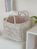 White floral print quilted storage basket with handle, large capacity foldable toy and laundry storage bag for kids' room organization.