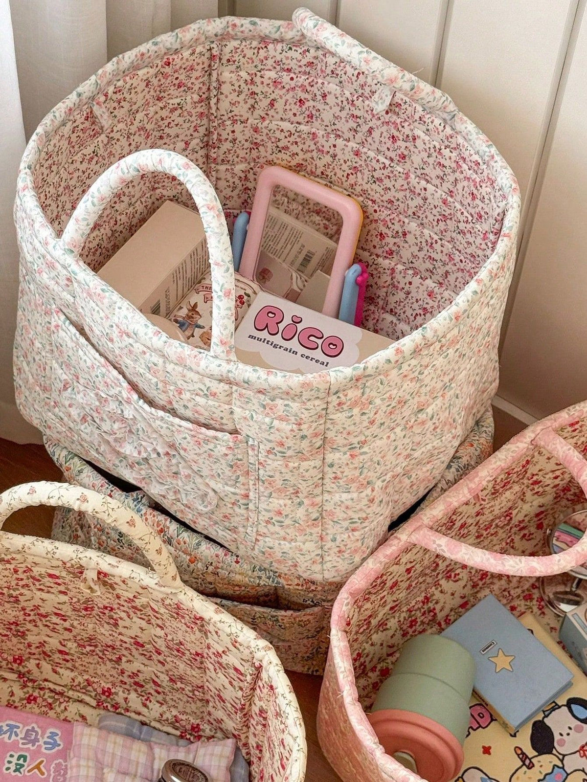 White floral print quilted storage basket with handle, large capacity toy and laundry organizer for kids and baby storage.