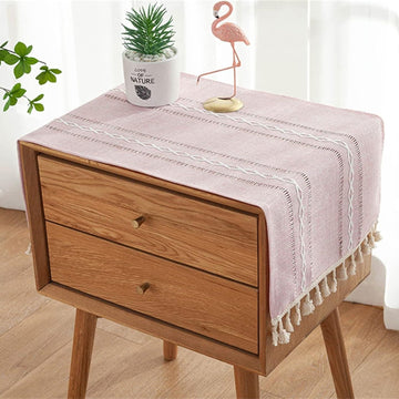 Pink boho-style rectangular tablecloth with tassel stripe pattern, polyester woven fabric, perfect for dressers, bedside tables, or cabinets.