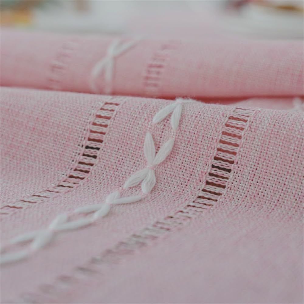 Pink boho style rectangular tablecloth with tassel stripe pattern on woven polyester fabric, ideal for dressers, bedside tables, or cabinets.