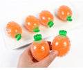 Five carrot-shaped squeeze stress relief balls for adults, made of elastic material, perfect as toy, vase filler, or Easter basket filler.