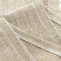 Boho style brown rectangular polyester tablecloth with tassel stripe pattern on a dresser or bedside table, 38x91cm.