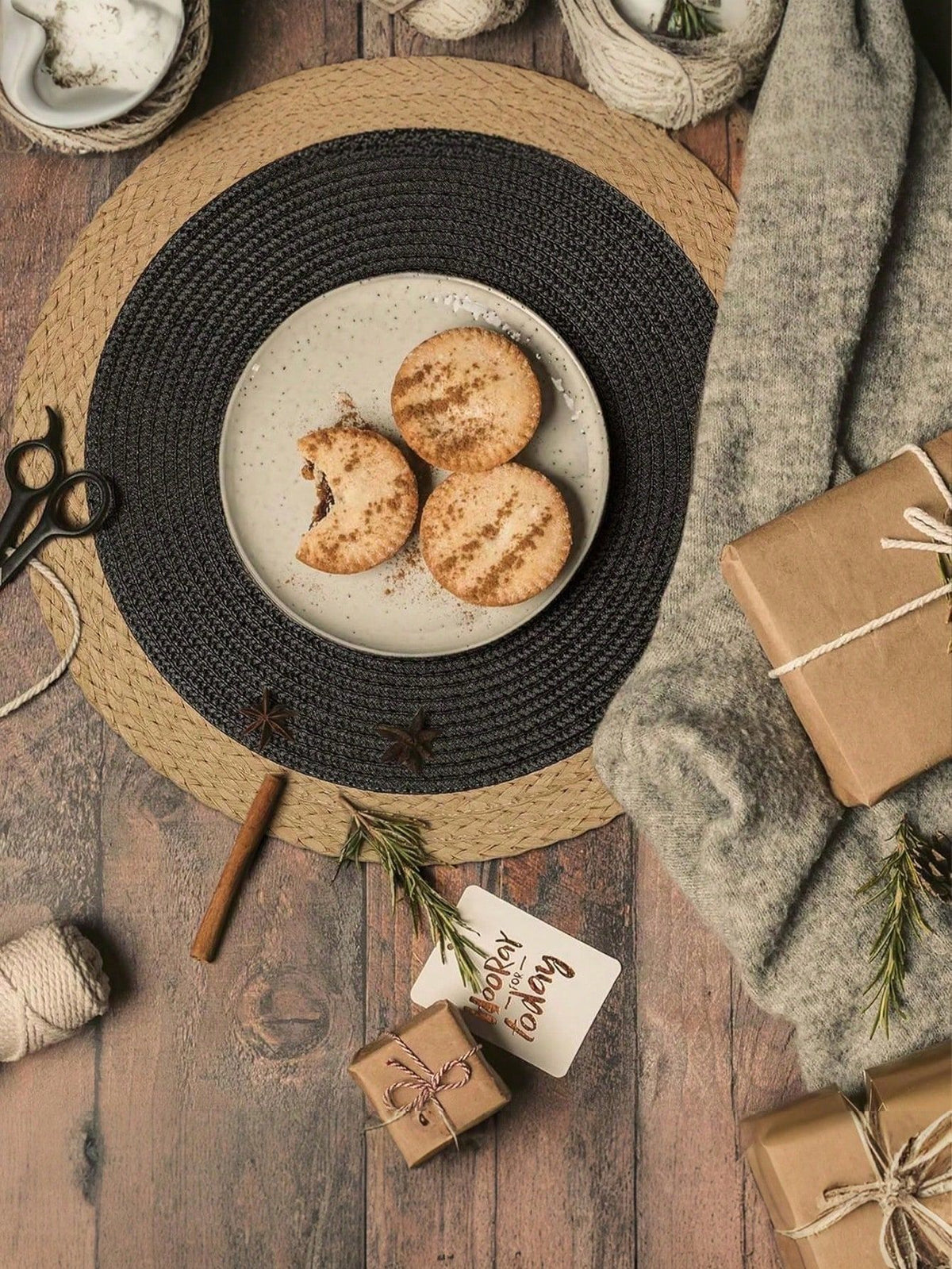 Set of four 15-inch black woven placemats with paper edges, washable and heat-resistant, ideal for indoor and outdoor parties.