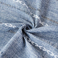 Blue boho-style rectangular tablecloth with tassel stripe pattern, polyester woven fabric on a kid's dresser or bedside table.