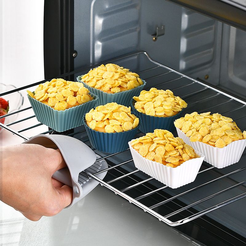 Reusable silicone cupcake liners in three shapes, ideal for baking muffins and pastries, with colorful round designs for kids.
