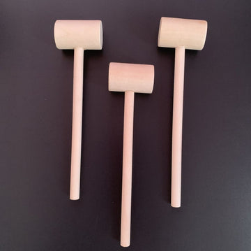 Set of 15 wooden hammers for kids' chocolate and craft play, smooth finish, handmade wooden mallets for educational building toys.
