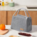 Insulated large lunch bag by Everything Baby with leakproof design, ideal for office, school, or travel, featuring colorful exterior.