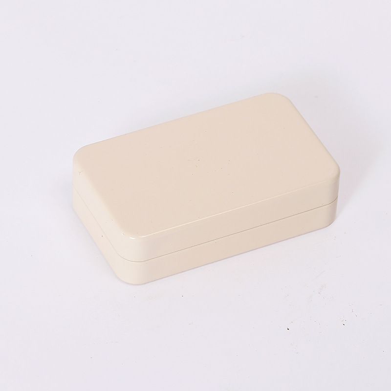 Set of four mini metal tin boxes with lids, perfect for small storage or organization, ideal for home or kid's room use.