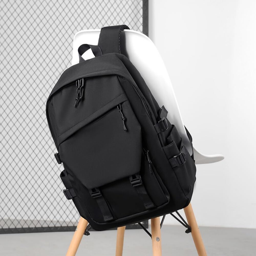 Black waterproof travel backpack with high capacity and side pockets, suitable for men, women, and kids, by Everything Baby.