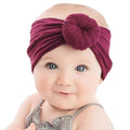 Set of three handmade baby hairbands with bows and elastics, suitable for newborns, infants, and toddlers from Everything Baby.